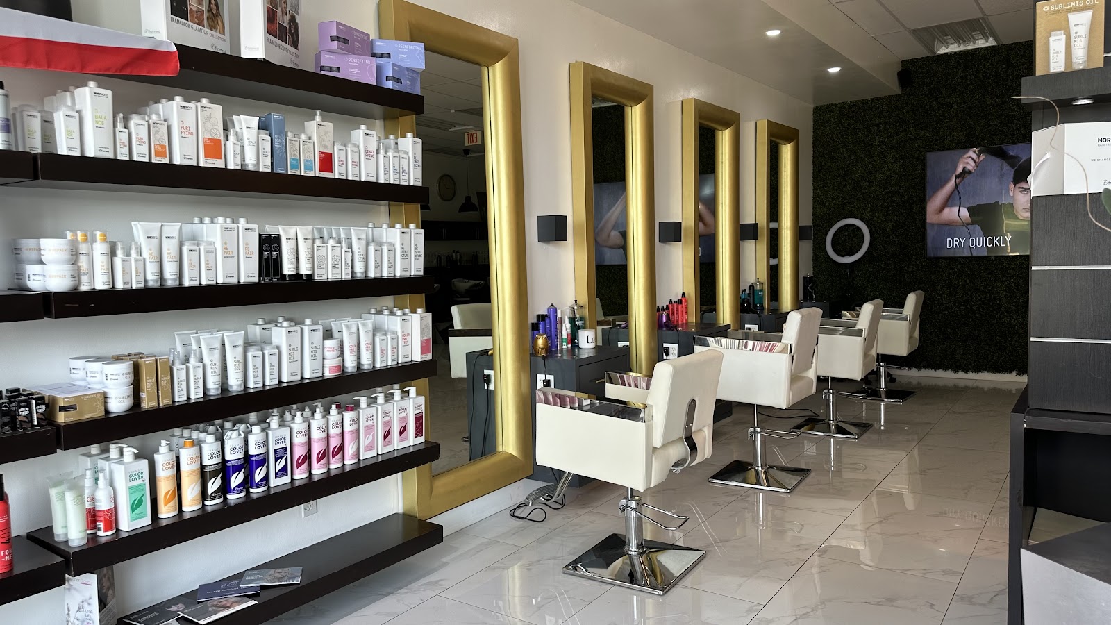 Color product wall and styling chairs at the salon